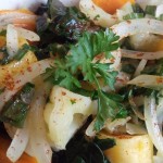 Buttered vegetables garnish with onions, cilantro and cayenne